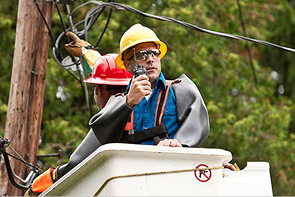 Utility worker using radio