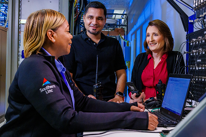 3 people working together